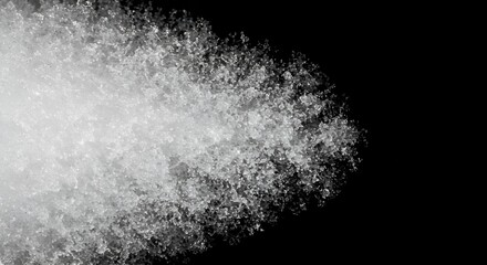 Close-up of frozen water crystals in a granular, clustered form against a black background. Crystalline ice texture with a speckled appearance.