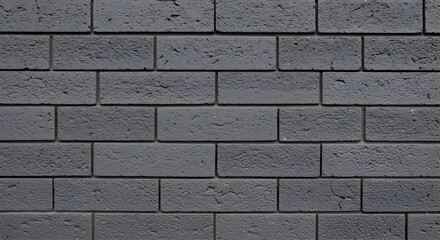 Dark gray brick wall texture showcasing a detailed brickwork pattern. Architectural facade design with no people or objects.