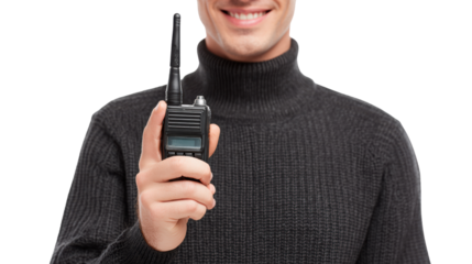 Smiling man in a black sweater holding a walkie-talkie against a white background.