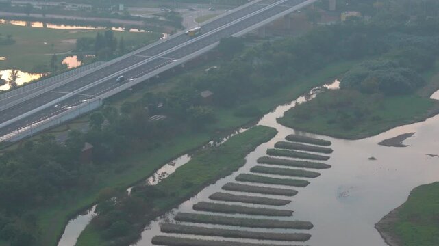 2024.12 Macau gazes toward Shenzhen amid haze, elevated road, river view