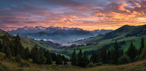 Obraz premium A breathtaking panoramic view of the majestic Alpine mountains at sunrise, with snow-capped peaks and lush purple meadows under an orange sky filled with clouds, mountain