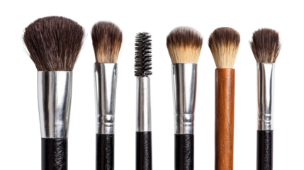 Collection of professional makeup brushes on a white isolated background.