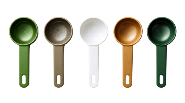 Colorful measuring cups arranged in a line on a white background.