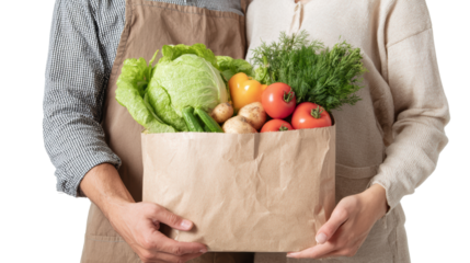 Couple holding a paper bag filled with fresh vegetables, showcasing healthy lifestyle choices.