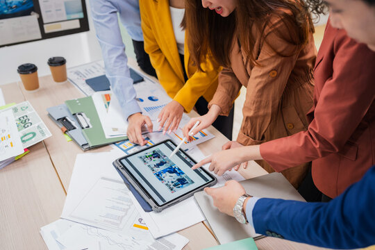 Business meeting showcases agile brainstorming with data analysis charts on tablets. Financial growth prediction strategy through predictive analytics and data-driven insights for strategic business  - Powered by Adobe