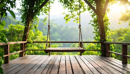 An empty wooden swing hangs from a tree on a wooden platform overlooking a lush, green forest landscape bathed in warm sunlight.