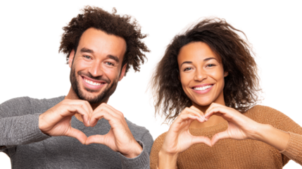 Happy couple making heart shape with hands, smiling in a joyful moment, white isolate background.
