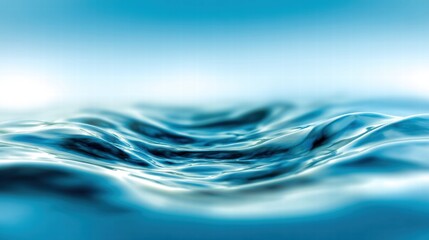 Close-up of water surface with gentle waves, creating a serene and abstract scene with calming blue tones.