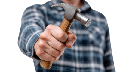 Man holding a hammer, ready for DIY projects, with a checkered shirt and a focused expression.
