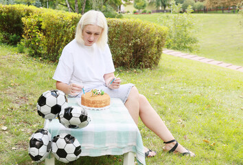 Celebrating a Memorable Birthday With Soccer-Themed Decorations and a Delicious Cake in a Vibrant Garden Setting