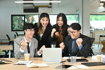 Obraz premium Success, applause and high five, business people with laptop in office with happy teamwork achievement. Congratulations, cheers and support for winner