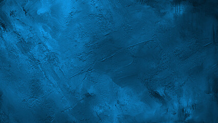 Vintage blue texture for background. Artistic plaster. Abstract pattern. Illuminated rough surface. 