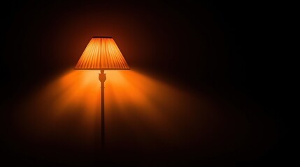A warm, orange lamp illuminates a dark room.