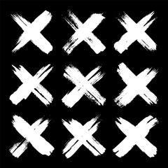 Obraz premium Grunge crosses, brush strokes, x mark, lines, ink smudges, hand-drawn scribble shapes. Handmade sketchy marks, acrylic stains, charcoal streaks. Paint textures, dry brush effect. Vector illustration