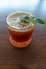 
A unique and refreshing yuzuricano, a blend of espresso and yuzu, garnished with mint and a dried lime slice. Perfect for coffee shop menus, blogs, and social media