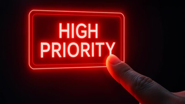 High priority glowing red button technology pressed by finger symbolizing urgent smart factory predictive maintenance concept