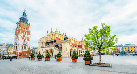Obraz premium Main street Rynek Głowny in Krakow with square and church St. Mary's Basilica in Poland