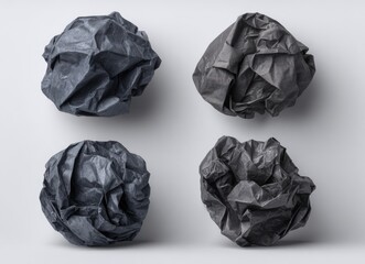 Fototapeta premium Four crumpled paper balls on white