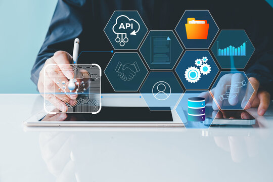 AI and API automation. Data transfer through system integration. Intelligent process automation technology solutions. Businessman using tablet for managing communicate technology.