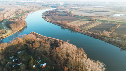 Fototapeta premium River winding through green countryside landscape
