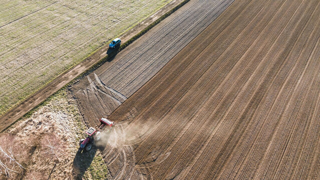 Farmer??Ts tractor preparing land for crops