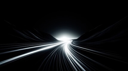 A black and white image of a winding road leading to a bright light at the end.