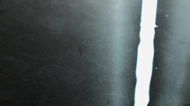 water dripping on the floor making a puddle in the room.
Roof leaking in the room and water dripping on the floor.
Wet floor and puddle in a dark room.
Water, splash, drops, leak, breakage