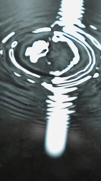 A leaking roof and water pouring onto the floor creating a large puddle.
A puddle on the floor and drops of water flowing down.
Splashes of water hitting the puddle.
Puddle, water, streak, leak