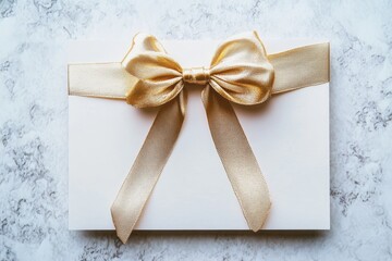 Luxury gift card adorned with a metallic gold ribbon bow for a high-end retail display