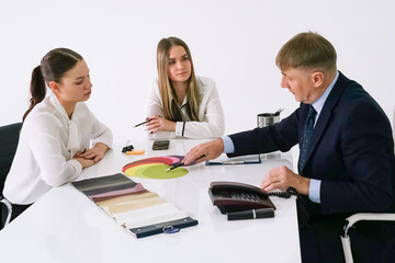 Fototapeta premium Business meeting with professionals discussing color options for a project