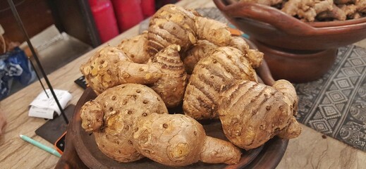 Close up of Temu Lawak roots on wooden plate