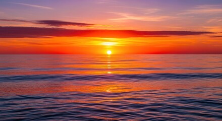 Obraz premium Vibrant Sunset Over Calm Ocean Waters with Dramatic Sky Colors.