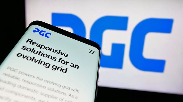 Stuttgart, Germany - 08-22-2025: Mobile phone with website of US company Power Grid Components Inc. (PGC) on screen in front of logo. Focus on top-left of phone display.