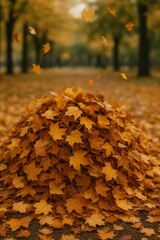 Pile of Fallen Maple Leaves with More Leaves Falling in Autumn