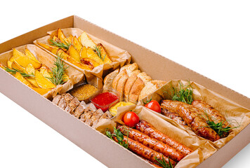 Delicious mixed platter featuring meats, potatoes, and bread for sharing