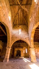 Fototapeta premium Ancient church interior, arches and wooden roof