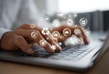 Close-up of hands typing on a laptop with digital icons overlay