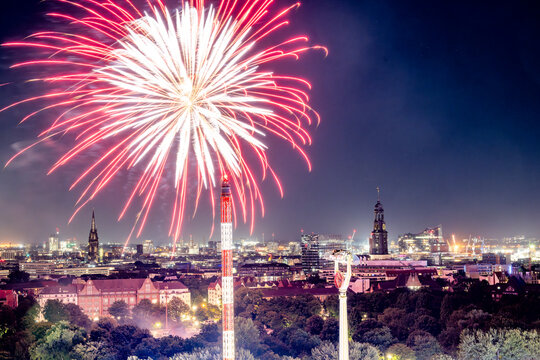 Firework over Hamburger Dom fairground in St Pauli Hamburg at night