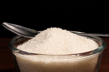 white sugar on black background