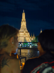 Bangkok, Thailand-September12,2023 :Wat Arun Ratchawararam Ratchawaramahawihan or Wat Arun (Temple of Dawn) at night along the Chao phraya
river. Bangkok, Thailand.