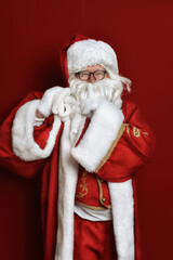 Real authentic Christmas photo of Santa Claus on a red background