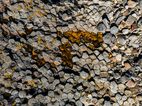 Aerial view of intricate basalt columns, etched with golden hues, forming a mesmerising mosaic of nature's artistry, K&Atilde;&iexcl;lfshamarsv&Atilde;&shy;k, H&Atilde;&ordm;nabygg&Atilde;&deg;, Iceland.