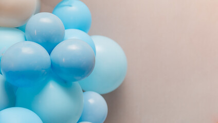 Pastel blue balloons on neutral background, simple minimal festive decoration for birthday, party, wedding or baby shower celebration.