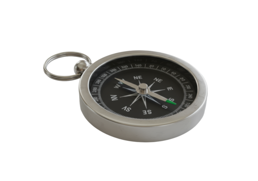 A polished silver pocket compass with emerald tip needle pointing north on a pristine light grey surface, isolated studio shot, rule of thirds, soft light, concept of strategic business guidance