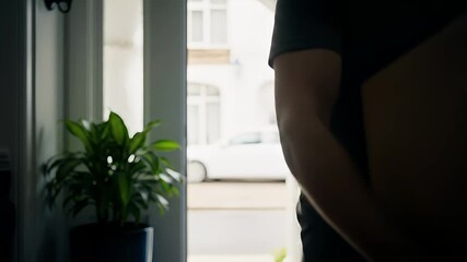 Man brings large package inside his home delivery