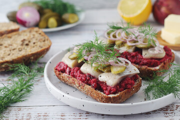 Scandinavian sandwiches with herring and beetroot