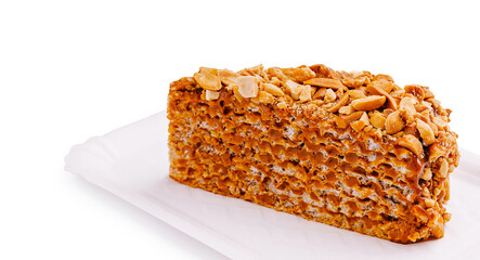 Delicious dessert made with nuts and caramel served on white paper