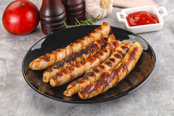 Grilled meat sausages wrapped bacon