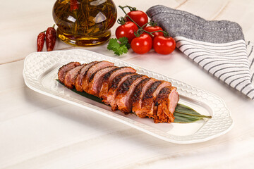 Sliced duck breast baked with cherry