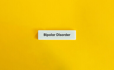 Bipolar Disorder Text on Letter Tile with Minimal Yellow Background